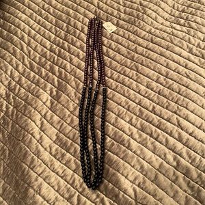 Purple and black pearl necklace with diamond accents